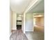 Well-lit hallway with smooth walls, updated flooring, and easy access to adjacent rooms at 4363 Stonewall Tell Rd, Atlanta, GA 30349