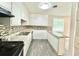 Well-equipped kitchen featuring updated cabinets, counter tops, and sleek backsplash at 4363 Stonewall Tell Rd, Atlanta, GA 30349