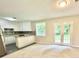 Open-concept living room boasting a stylish kitchen and bright, naturally lit spaces at 4363 Stonewall Tell Rd, Atlanta, GA 30349