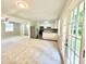 Bright living room featuring new carpet, stainless steel appliances, and access to outdoor patio at 4363 Stonewall Tell Rd, Atlanta, GA 30349