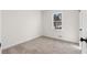 Bright bedroom with neutral carpet, ample natural light, and fresh white walls at 7000 Woodland Nw Pl, Kennesaw, GA 30152
