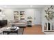Comfortable living room with modern decor, hardwood floors, and a bright, airy feel at 7000 Woodland Nw Pl, Kennesaw, GA 30152