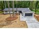 Landscaped, single-story home with gray siding, gray roof, a front-entry garage, and a long driveway at 1329 Hidden Hills Pkwy, Stone Mountain, GA 30088