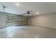A spacious garage with gray epoxy flooring and a modern glass panel door at 1329 Hidden Hills Pkwy, Stone Mountain, GA 30088