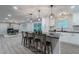 Open concept kitchen includes stainless appliances, quartz counters, an island with bar stool seating at 1329 Hidden Hills Pkwy, Stone Mountain, GA 30088