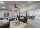 Open concept living room boasts vaulted ceilings, pendant lighting and views into the kitchen at 1329 Hidden Hills Pkwy, Stone Mountain, GA 30088