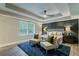 Relaxing main bedroom featuring an accent wall, tray ceiling, and luxury furnishings at 1329 Hidden Hills Pkwy, Stone Mountain, GA 30088