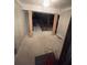 Covered porch with vertical siding, wood columns, and concrete floor at 1329 Hidden Hills Pkwy, Stone Mountain, GA 30088