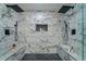 Modern shower featuring dual shower heads, marble-patterned tiling and a built-in soap niche at 1329 Hidden Hills Pkwy, Stone Mountain, GA 30088