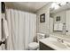 Bathroom with a white shower curtain, neutral colored walls, and a dark vanity at 162 Lablanc Nw Way, Atlanta, GA 30327