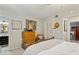 Cozy bedroom with ample storage, neutral tones and view of ensuite bath and sitting room at 162 Lablanc Nw Way, Atlanta, GA 30327