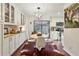 Bright dining area with stylish lighting, white cabinetry and a large sliding glass door at 162 Lablanc Nw Way, Atlanta, GA 30327