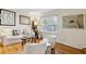 Cozy living area with hardwood floors, neutral palette, stylish furnishings, and a view of the outdoors at 162 Lablanc Nw Way, Atlanta, GA 30327