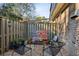 Private patio with a wooden fence, brick, gravel, and a small seating area at 162 Lablanc Nw Way, Atlanta, GA 30327