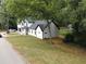 A tranquil aerial view showcasing the home, its freshly laid lawn, and the surrounding trees at 2764 Midway Rd, Decatur, GA 30030