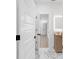 Bright bathroom features wood cabinet, and open doorway into the hall at 2764 Midway Rd, Decatur, GA 30030