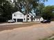 Stunning two-story home with black trim, a 2-car garage, and long driveway at 2764 Midway Rd, Decatur, GA 30030