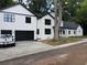 White, two-story home with a black roof, and a freshly laid lawn at 2764 Midway Rd, Decatur, GA 30030