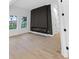 Cozy living area featuring a modern fireplace and hardwood floors at 2764 Midway Rd, Decatur, GA 30030