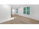 Spacious living room with hardwood floors and large windows with view of trees at 2764 Midway Rd, Decatur, GA 30030