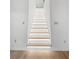 Modern staircase with ambient lighting and hardwood floors at 2764 Midway Rd, Decatur, GA 30030