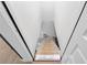 Basement stairwell with unfinished stairs and door at top of stairwell at 2764 Midway Rd, Decatur, GA 30030