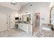 Spacious bathroom with granite countertops, dual sinks, white cabinetry, and modern fixtures at 5173 Brendlynn Dr, Suwanee, GA 30024