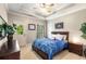 Comfortable bedroom features a tray ceiling and a door to the backyard at 5173 Brendlynn Dr, Suwanee, GA 30024