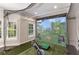 A golf simulator room featuring a large screen, artificial turf, and all necessary equipment at 5173 Brendlynn Dr, Suwanee, GA 30024