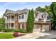 Beautiful two-story brick and siding home with a two-car garage and well-maintained landscaping at 5173 Brendlynn Dr, Suwanee, GA 30024