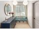 Bright hallway nook featuring a window seat, drawers, and pendant lighting, ideal for relaxation at 5173 Brendlynn Dr, Suwanee, GA 30024