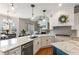 Bright, open kitchen with granite countertops, a center island, and stainless steel appliances at 5173 Brendlynn Dr, Suwanee, GA 30024