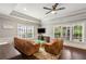 Cozy living room with recessed lighting, a ceiling fan, and a hardwood floor at 5173 Brendlynn Dr, Suwanee, GA 30024