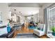 Living space with an open floor plan with bar seating, kitchen, dining area and lots of natural light at 5173 Brendlynn Dr, Suwanee, GA 30024