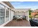 Relaxing outdoor patio with comfortable seating, lattice screens, and grill at 5173 Brendlynn Dr, Suwanee, GA 30024