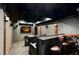Home theater room with reclining seats, a wet bar, and a large screen for entertainment at 5173 Brendlynn Dr, Suwanee, GA 30024