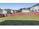 Large backyard with a well-maintained lawn surrounded by a wooden fence at 139 Palmetto St, Locust Grove, GA 30248