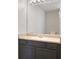 Bathroom vanity featuring neutral countertops and dark cabinets at 139 Palmetto St, Locust Grove, GA 30248