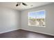 Bedroom with a large window and a view of the neighborhood at 139 Palmetto St, Locust Grove, GA 30248