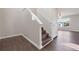 Open foyer with wood flooring and a staircase leading to the upper level at 139 Palmetto St, Locust Grove, GA 30248