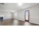 Cozy living room with dark floors, a ceiling fan, and fireplace at 139 Palmetto St, Locust Grove, GA 30248