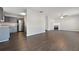 Open floorplan with views of the kitchen and living room fireplace at 139 Palmetto St, Locust Grove, GA 30248