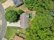Aerial view of property with mature trees, large lot, and circular driveway at 2623 Lone Oak Nw Trl, Kennesaw, GA 30144