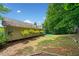 Scenic backyard with mature trees and patio area, perfect for relaxing and enjoying nature at 2623 Lone Oak Nw Trl, Kennesaw, GA 30144