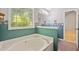 Bathroom showcasing a large soaking tub and window, providing a spa-like atmosphere at 2623 Lone Oak Nw Trl, Kennesaw, GA 30144
