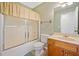 Bathroom with a tub and shower combo, vanity with wood cabinets, and neutral walls at 2623 Lone Oak Nw Trl, Kennesaw, GA 30144