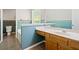Bathroom featuring a single sink vanity, tiled floor, and unique blue and white wall design at 2623 Lone Oak Nw Trl, Kennesaw, GA 30144