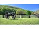 Civil War site with cannon, split rail fence, and a historic building in a lush green environment at 2623 Lone Oak Nw Trl, Kennesaw, GA 30144