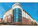 A tall college building with a curved glass facade and the university logo on top at 2623 Lone Oak Nw Trl, Kennesaw, GA 30144