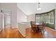 Bright dining area featuring hardwood floors, large windows, and stylish light fixtures at 2623 Lone Oak Nw Trl, Kennesaw, GA 30144